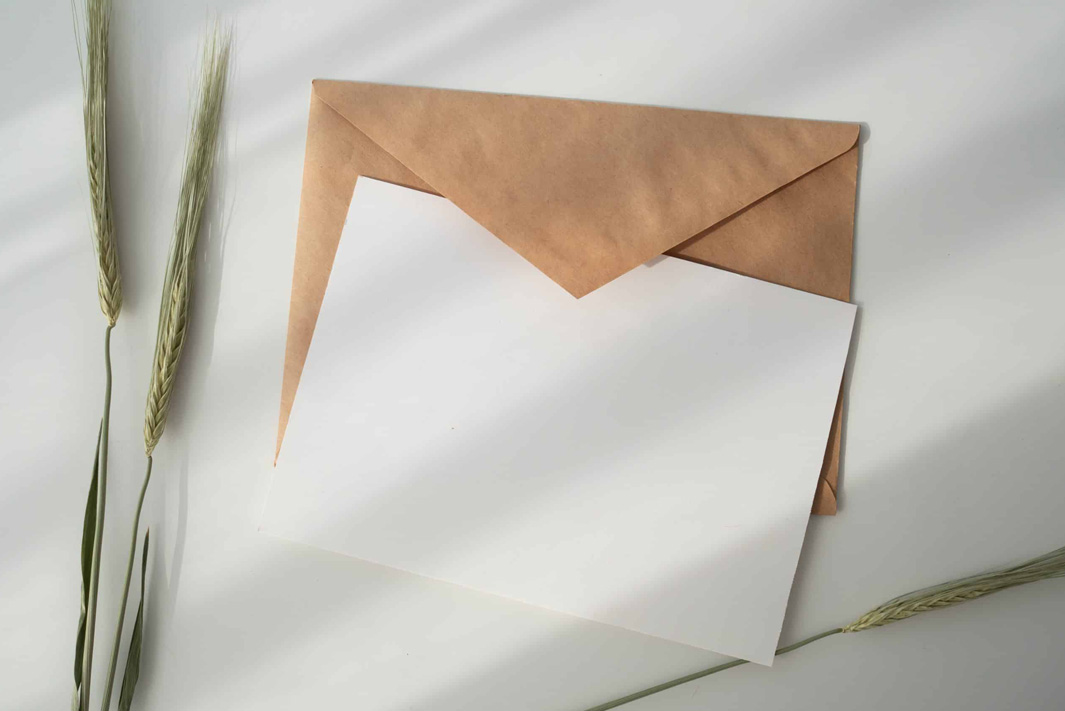 A piece of paper on top of its envelope
