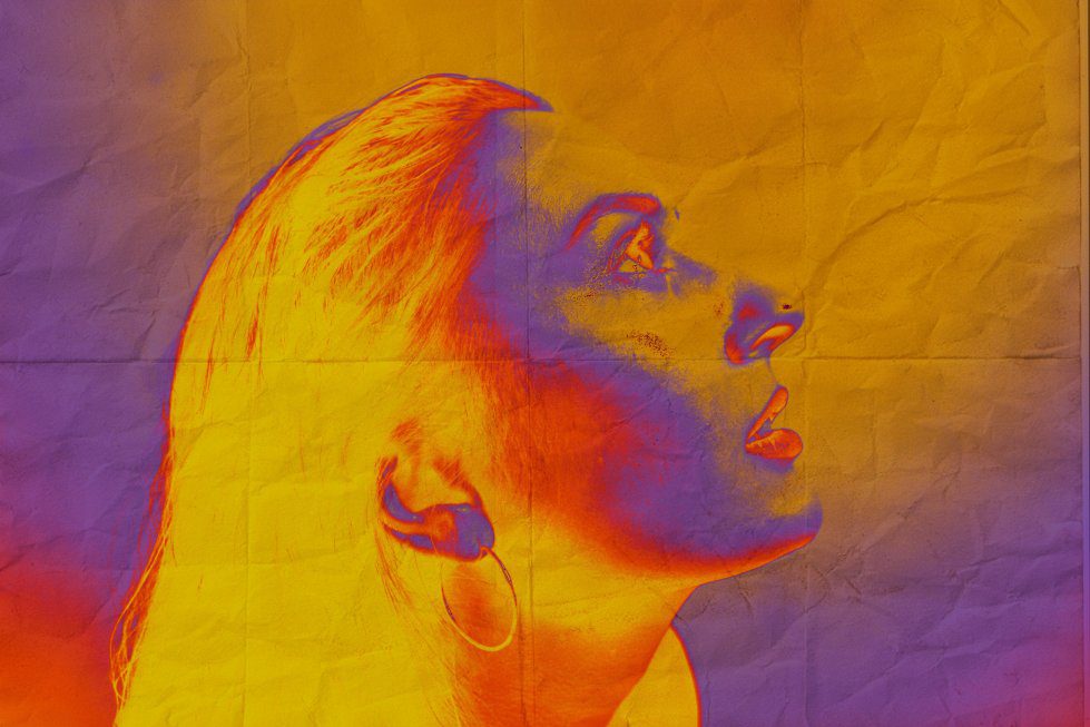high contrast image of woman looking upwards